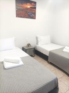 Postel nebo postele na pokoji v ubytování Sea-Cret Beachfront Apartment