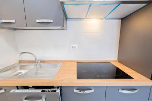 a kitchen with a sink and a counter top at Casa Del Sole in Lanciano