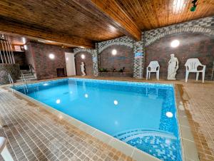 a large swimming pool in a brick building at Royal Pier in Sandown