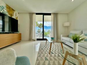 TV a/nebo společenská místnost v ubytování La Paloma Seaview Apartment
