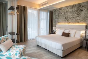 Postel nebo postele na pokoji v ubytování Vision Hotel