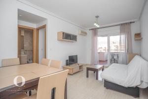 Televízia a/alebo spoločenská miestnosť v ubytovaní Holiday Deluxe Magic World Playa Coral I