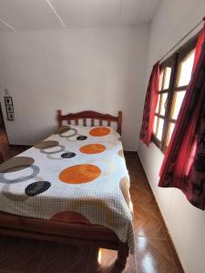 Una cama o camas en una habitación de Hostel VERBENITA