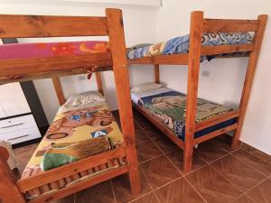 Una cama o camas en una habitación de Hostel VERBENITA