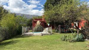 a backyard with a playground with a water fountain at Luz del Rincón in Merlo