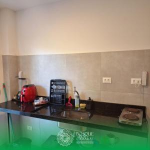 a kitchen with a counter top with a sink at Refúgio Vista Bosque x Piscina in Camaragibe