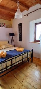a bedroom with a large bed in a room at Apartments Elena & Damir in Vis