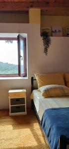 a bedroom with a bed and a window at Apartments Elena & Damir in Vis