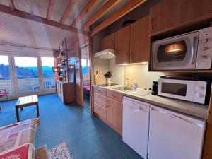 Kuchyň nebo kuchyňský kout v ubytování Appartement 2 pièces au pied des pistes de ski avec balcon et parking - FR-1-515-31 + 4 fotografie