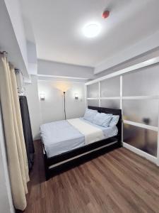 En eller flere senge i et værelse på nkz's staycation