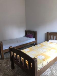 Кровать или кровати в номере Hostel Limoeiro