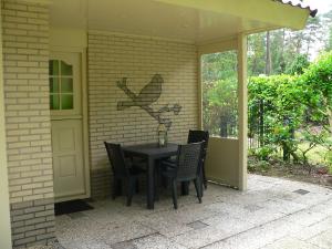 Zahrada ubytování Vakantiewoning Bosvogel + 6 fotografií