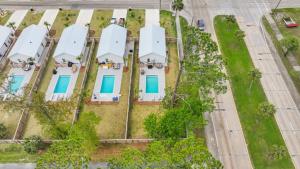 an overhead view of a white house with blue doors at Beach House - Simple Pleasures by Panhandle Getaways in Port Saint Joe