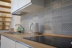 a kitchen with a sink and a counter top at Casa Ella in Cupra Marittima