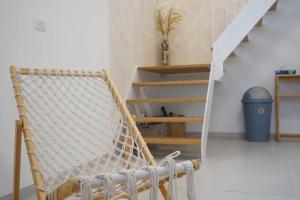 a hammock chair in a room with a staircase at Casa Ella in Cupra Marittima +31 photos