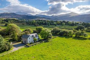 an aerial view of a house in a field at Perthi-Uchaf in Cwm-y-glo