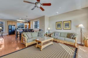 a living room with a couch and a table at Jacks Beach House by Carolina Beach Realty in Carolina Beach