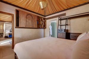 Ένα ή περισσότερα κρεβάτια σε δωμάτιο στο Palmeraie Oasis Camp - A member of Barcelo Hotel Group