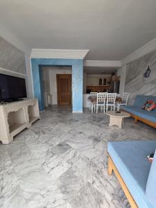 a living room with a couch and a table at Luxurious 2 bedroom apartment in Sousse
