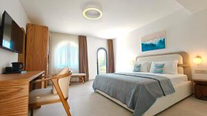 Postel nebo postele na pokoji v ubytování VILLA MARGARIT Boutique Hotel