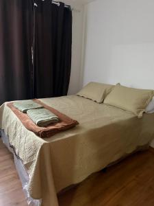 Ένα ή περισσότερα κρεβάτια σε δωμάτιο στο Apartamento Plantar e Cuidar