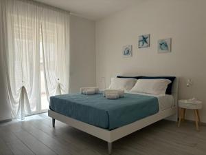 Postel nebo postele na pokoji v ubytování BluMare Ospiti