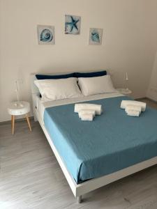 Postel nebo postele na pokoji v ubytování BluMare Ospiti
