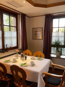 a dining room with a table and chairs at Landgasthof Zum Engel in Angelbachtal