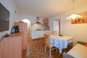 Kuchyň nebo kuchyňský kout v ubytování Apartments Ferdigg