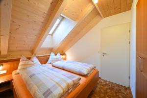 Postel nebo postele na pokoji v ubytování Apartments Ferdigg
