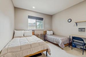 a bedroom with two beds and a window at Whispering Pines Haven in Redmond +31 photos