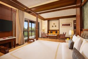Postel nebo postele na pokoji v ubytování Aahana Resort - Jim Corbett + 37 fotografií