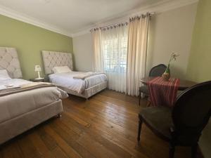 Postel nebo postele na pokoji v ubytování Casona Checacupe