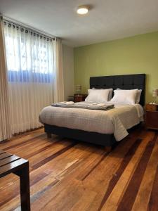 Postel nebo postele na pokoji v ubytování Casona Checacupe