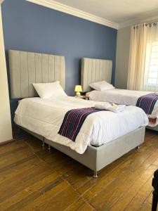 Postel nebo postele na pokoji v ubytování Casona Checacupe