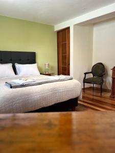 Postel nebo postele na pokoji v ubytování Casona Checacupe