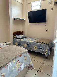 3D Casa para Temporada em Manaus - Próx à Base Aérea e Centro de Manaus客房内的一张或多张床位