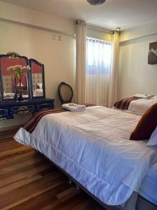 Postel nebo postele na pokoji v ubytování Casona Checacupe