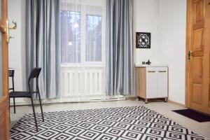 a room with a window and a table and a chair at Sweet Apple Garden in Almaty