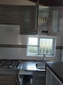 Kuchyň nebo kuchyňský kout v ubytování Cabañas hotel COLONIA SAN MIGUEL