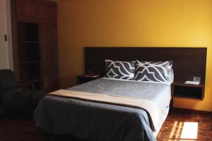 Postel nebo postele na pokoji v ubytování Kunan Hotel