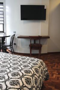TV a/nebo společenská místnost v ubytování Kunan Hotel