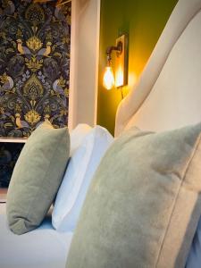 a bedroom with a bed with two pillows on it at Casa D'Almeida by Porto Stories in Porto