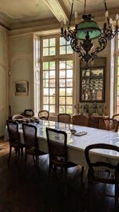 a large dining room with a large table and chairs at Le Val du Roy in Joinville +54 photos
