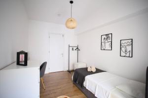 Ένα ή περισσότερα κρεβάτια σε δωμάτιο στο Sunrise Living I Central
