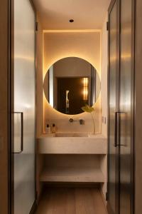 a bathroom with a sink and a mirror at Velvet Grey Boutique Hotel Roma in Rome