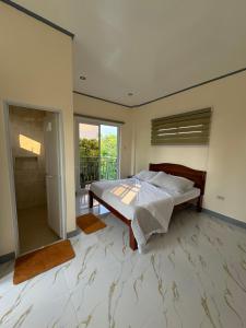 a large bedroom with a bed and a shower at Octagon in Caylaway