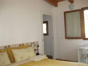Posteľ alebo postele v izbe v ubytovaní Country House-B&B-Appartamenti Ai Cipressi + 26 fotografií