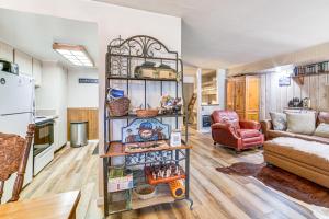 a living room with a couch and a table at Walk to Shops & Eats: Mammoth Lakes Condo w/ Pool in Mammoth Lakes