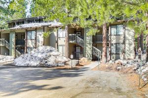 a house with a large rock in front of it at Walk to Shops & Eats: Mammoth Lakes Condo w/ Pool in Mammoth Lakes
